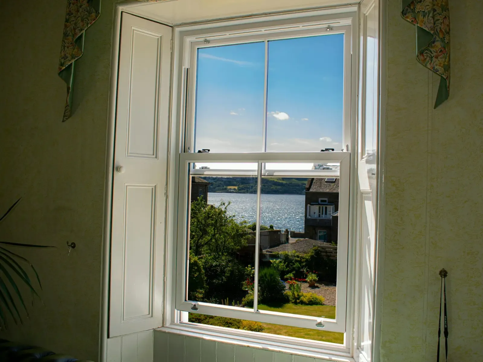 White uPVC vertical sliding sash window installation, Dundee