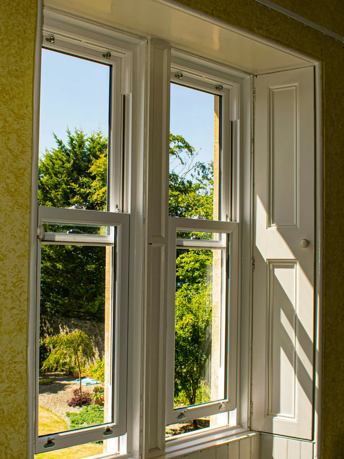 White uPVC sliding sash window installation, Dundee